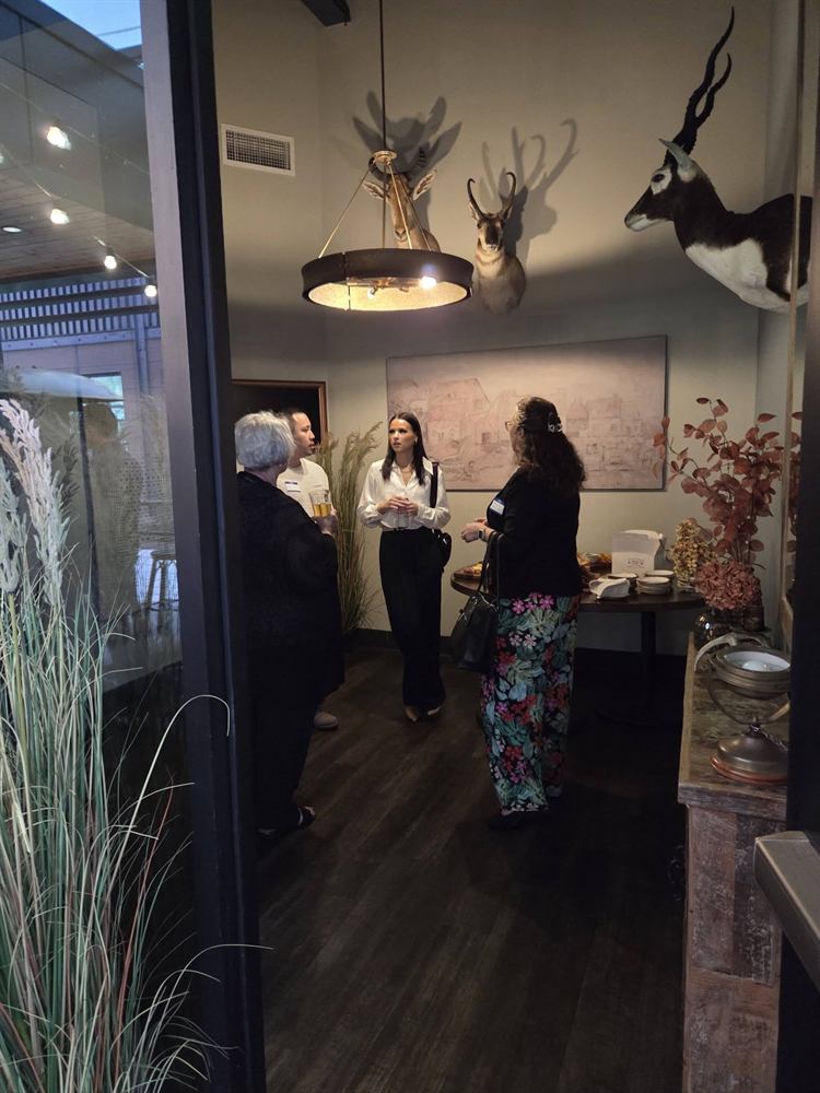 Guests networking inside the upscale dining room at 24 Middleton